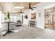 Open living room with wood ceiling, plenty of natural light, and seamless flow into the kitchen at 6041 Garver Rd, Indianapolis, IN 46208