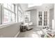 Cozy sitting room featuring natural light, a comfortable chair, and a skylight at 6041 Garver Rd, Indianapolis, IN 46208