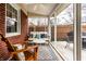 Relaxing sunroom features ample natural light, comfortable seating, and a view of the outdoors at 6041 Garver Rd, Indianapolis, IN 46208
