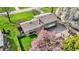 Attractive home showcasing mature landscaping, a spacious driveway, and a well-maintained backyard at 6377 Green Leaves Rd, Indianapolis, IN 46220