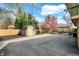 Large backyard with a shed, basketball hoop, pergola-covered seating area, and lush landscaping at 6377 Green Leaves Rd, Indianapolis, IN 46220