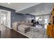 Relaxing finished basement featuring a large sectional, exercise equipment, and access to the backyard at 6377 Green Leaves Rd, Indianapolis, IN 46220