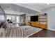 Open finished basement with fireplace, comfortable seating, media center, and backyard access at 6377 Green Leaves Rd, Indianapolis, IN 46220