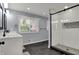 Contemporary bathroom featuring a double vanity, walk-in shower, and sleek, modern design at 6377 Green Leaves Rd, Indianapolis, IN 46220