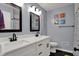 Modern bathroom with double vanity, updated fixtures, and a clean, stylish design at 6377 Green Leaves Rd, Indianapolis, IN 46220
