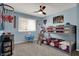 Charming bedroom featuring a bunk bed, sports decor, and a comfortable carpet at 6377 Green Leaves Rd, Indianapolis, IN 46220