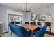 Modern dining area with a view into a stylishly renovated kitchen and open floor plan at 6377 Green Leaves Rd, Indianapolis, IN 46220