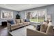 Comfortable living room featuring large windows, neutral tones, and plush seating at 6377 Green Leaves Rd, Indianapolis, IN 46220