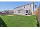 This backyard has a well-maintained lawn, a trampoline, and a patio with outdoor furniture at 6557 Eagles Nest Ln, McCordsville, IN 46055