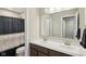 This bathroom features dual sinks, modern fixtures, and a shower with a decorative curtain at 6557 Eagles Nest Ln, McCordsville, IN 46055
