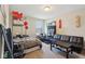 This bedroom features modern decor, a bed, and a black futon with a coffee table at 6557 Eagles Nest Ln, McCordsville, IN 46055