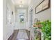 Bright foyer with wood flooring, a view through the front door, and decorative accents at 6557 Eagles Nest Ln, McCordsville, IN 46055
