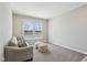 Bright living area with neutral walls and soft carpet, perfect for relaxation and comfort at 6557 Eagles Nest Ln, McCordsville, IN 46055