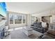 Bright living room with large windows, a cozy sofa, and views to the outside at 6557 Eagles Nest Ln, McCordsville, IN 46055