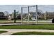 Enjoy a beautiful day out at the community swings with a stunning view of the pond and nearby homes at 6557 Eagles Nest Ln, McCordsville, IN 46055