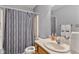 Well-lit bathroom with a shower-tub combo, vanity, and updated fixtures at 760 Sable Ridge Dr, Greenwood, IN 46142