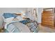 Bedroom featuring a wood-framed bed with a sports-themed quilt, carpeted floor, and access to an ensuite bathroom at 760 Sable Ridge Dr, Greenwood, IN 46142