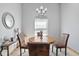 Inviting dining room with a round wood table and decorative light fixture at 760 Sable Ridge Dr, Greenwood, IN 46142