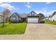 Charming single-Gathering home featuring a two-car garage, well-maintained lawn, and inviting curb appeal at 760 Sable Ridge Dr, Greenwood, IN 46142