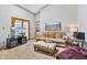 Bright living room with high ceilings, comfortable seating, and natural light from the sliding doors at 760 Sable Ridge Dr, Greenwood, IN 46142
