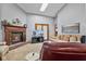 Cozy living room with a skylight, fireplace, comfortable seating, and an entertainment center at 760 Sable Ridge Dr, Greenwood, IN 46142