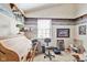 Dedicated office space with rolltop desk, shelving, and window at 760 Sable Ridge Dr, Greenwood, IN 46142