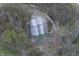 Aerial view of a stunning waterfall surrounded by lush forest, revealing a natural attraction nearby the property at 7809 S Solitude Ln, Trafalgar, IN 46181
