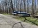 Boat storage area with boats on trailers surrounded by mature trees, perfect for boating enthusiasts at 7809 S Solitude Ln, Trafalgar, IN 46181