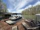 Waterfront property showing private dock featuring pontoon boat and lounge chairs perfect for relaxing at 7809 S Solitude Ln, Trafalgar, IN 46181