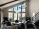 Bright living room with high ceilings, skylight, large windows, and modern chandelier at 7809 S Solitude Ln, Trafalgar, IN 46181