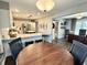 Open-concept living room flowing into a modern kitchen with stainless steel appliances and breakfast bar seating at 7809 S Solitude Ln, Trafalgar, IN 46181