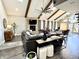 Inviting living room with vaulted ceilings, stone fireplace, and stylish decor at 7809 S Solitude Ln, Trafalgar, IN 46181