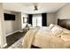 Inviting main bedroom with neutral color palette, dark wood accents, and sliding doors at 7809 S Solitude Ln, Trafalgar, IN 46181