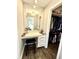 Vanity in a walk-in closet with ample storage and mirror at 7809 S Solitude Ln, Trafalgar, IN 46181