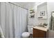 Bathroom with a shower-tub, toilet, modern vanity, and stylish decor at 8017 Wallingwood Dr, Indianapolis, IN 46256