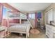 Bedroom offers a cozy retreat, featuring a bunk bed, two windows, and stylish decor at 8017 Wallingwood Dr, Indianapolis, IN 46256