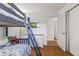 Bedroom featuring a bunk bed, wood floors, and closet space at 8017 Wallingwood Dr, Indianapolis, IN 46256
