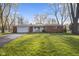 Charming single-story brick home featuring an attached garage and well-maintained front lawn at 8017 Wallingwood Dr, Indianapolis, IN 46256