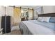 Comfortable main bedroom featuring a barn-style closet door and ensuite bathroom access at 8017 Wallingwood Dr, Indianapolis, IN 46256