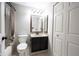 Bathroom featuring a vanity with mirror, shower tub combo, and a toilet at 8075 N Cardinal W Cv, Indianapolis, IN 46256