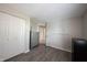 This bedroom features neutral walls, gray flooring, closet space and bright natural lighting at 8075 N Cardinal W Cv, Indianapolis, IN 46256