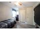 Bedroom featuring wood grain laminate flooring, neutral paint, and a ceiling fan at 8075 N Cardinal W Cv, Indianapolis, IN 46256