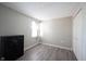This bedroom features neutral walls, a window, closet and modern gray flooring at 8075 N Cardinal W Cv, Indianapolis, IN 46256