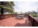 Lakeside deck featuring a table and chairs, perfect for outdoor dining and enjoying scenic water views and fresh air at 8075 N Cardinal W Cv, Indianapolis, IN 46256