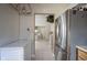 Hallway view of the kitchen featuring stainless steel appliances and an open layout at 8075 N Cardinal W Cv, Indianapolis, IN 46256
