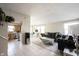 Bright living room showcasing an open floor plan with views of the kitchen and dining area, creating an inviting atmosphere at 8075 N Cardinal W Cv, Indianapolis, IN 46256