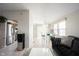 Open concept living room featuring neutral tones and access to the kitchen and dining area at 8075 N Cardinal W Cv, Indianapolis, IN 46256