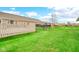 Spacious backyard featuring lush green lawn, white fence and privacy fence at 8242 Frankdale Ct, Indianapolis, IN 46259