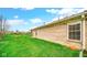 Well-maintained backyard featuring lush green grass, and a view of the brick home at 8242 Frankdale Ct, Indianapolis, IN 46259