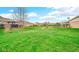 Expansive backyard with scenic pond views, providing a tranquil outdoor space at 8242 Frankdale Ct, Indianapolis, IN 46259